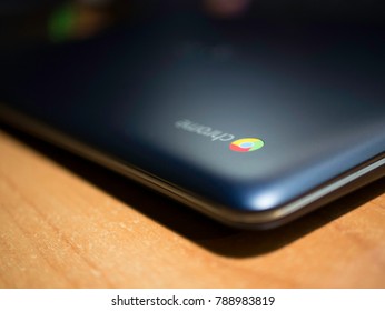 Blue Chromebook On A Wooden Table