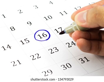 Blue circle. Mark on the calendar at 16. - Powered by Shutterstock