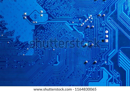 blue circuit board background of computer motherboard