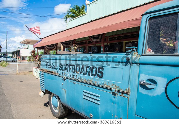 Blue classic surfboard car, van parked on\
the island of Oahu, Hawaii. Surfing\
spirit.
