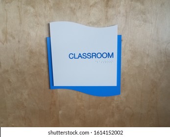 Blue Classroom Sign On Door With Braille