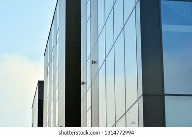 Blue clean glass wall of modern office building - Shutterstock ID 1314772994