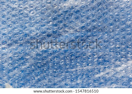 Blue & clear bubblewrap textured surface ready to pop.