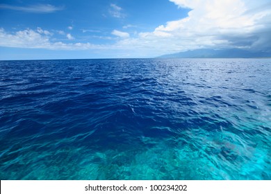 Blue Clear Sea With Waves And Sky With Clouds