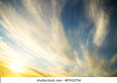 Blue cloudy sky with clouds on sunset