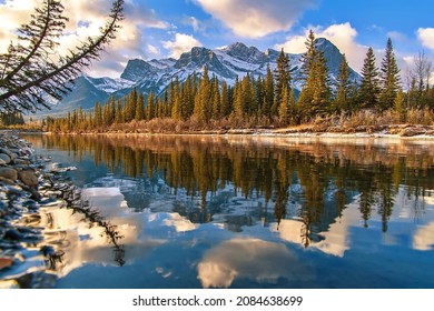 Blue Cloudy Sky Over Canmore Mountains And River Valley