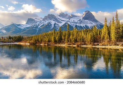 Blue Cloudy Sky Over Canmore Mountains And Bow River