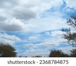 blue cloudy sky,a view of a cloudy sky over a highway, partly cloudy, visible sky and sunny atmosphere, ( eos 5 ds r, (eos 5ds r, cloudscape, visible sky and humid atmosphere, mostly cloudy, 
