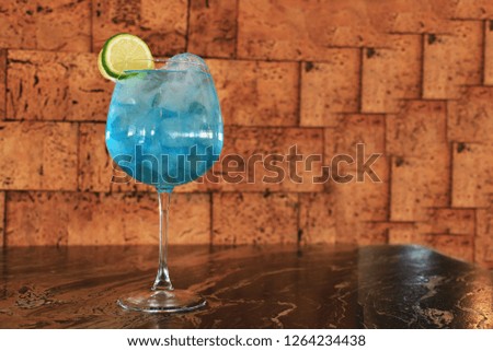Blue cocktail on the marble table.
