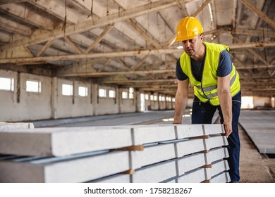 Blue Collar Worker Doing His Job At Construction Site.