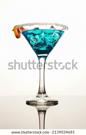 Blue color cocktail on the ice rocks