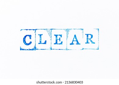 Blue color ink rubber stamp in word clear on white paper background