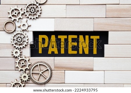 Blue color ink rubber stamp in word patent on white paper background.