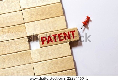 Blue color ink rubber stamp in word patent on white paper background