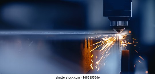 Blue color Laser CNC cut of metal with light spark, technology modern industrial. - Shutterstock ID 1685155366