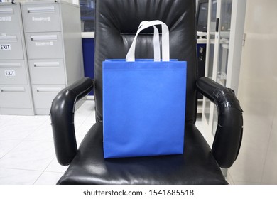 Blue Color Non Woven Polypropylene Bag On Chair, Eco Friendly Bag, Colorful Gift And Shopping Bag