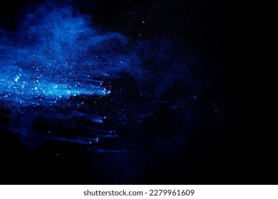 Blue  color powder explosion cloud on black background. Closeup of Blue  dust particles splash. - Powered by Shutterstock - Get 15% off with code: PIKWIZARD15