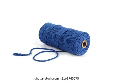 Blue Color Skein single strand Cotton cord rope for macrame on white. Use for DIY handcraft. Closeup Textile bobbin reel