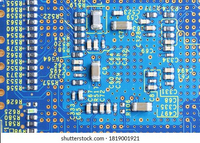 Blue computer printed circuit board with electronic components, Electronic circuit board close up. Surface-mount technology components.