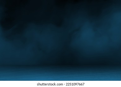 blue concrete marble stone floor with smoke float use as background for advertising. abstract dark blue background, smoke, smog. empty dark scene, neon light, spotlights. concrete floor.