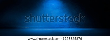 Blue concrete wall and floor with light and shadow backgrounds, use for product display for presentation and cover banner design.