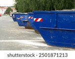 blue containers for the disposal of construction debris are almost not on the road