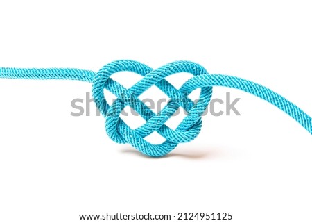 Blue cord heart shaped knot isolated on white background. Creative romantic concept.