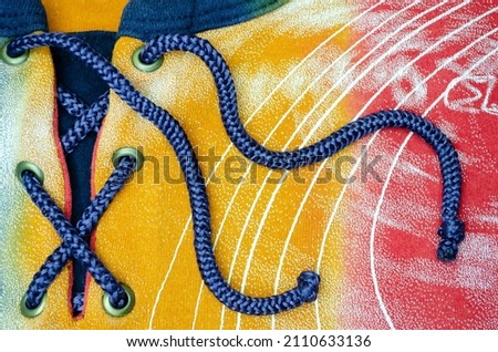 blue cord on the background of white streaks and stripes abstract colored background