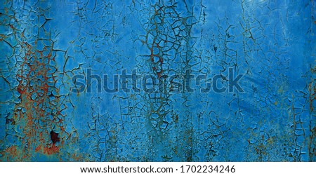 blue coroded metal sheet background with peeling paint flakes
