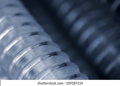 Blue corrugated pipe for cable; background; close-up