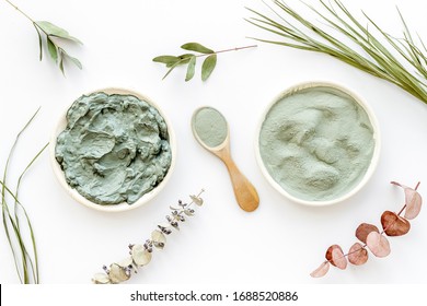 Blue cosmetic clay - face and body skin care - on white background top-down