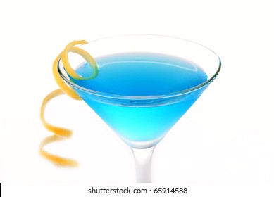 Blue Cosmopolitan cocktail with vodka, blue curacao, white cranberry juice, lime and orange spiral isolated on a white background - Powered by Shutterstock