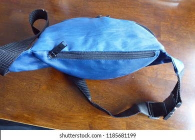 Blue Cotton Fanny Pack On Wooden Table