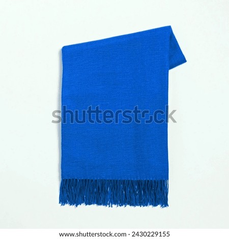 Blue cotton, wool and thread scarf. Thick and warm scarf for the coming season. Clothing to wear in autumn and winter frigid seasons. Outfit to keep your face, neck and back warm isolated on white