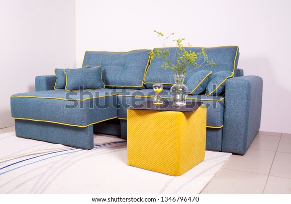 blue couch with pillows