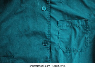 Blue coveralls detail. Working clothes detail.