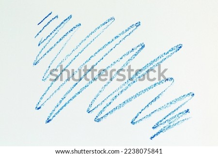 a blue crayon picture with a white paper background