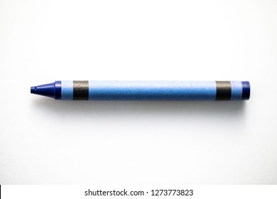 Blue Crayon Shot Close Up On A White Background