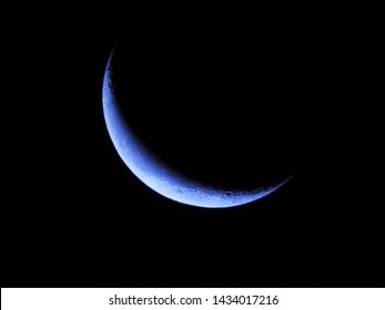 Blue Crescent Moon In Dark Night