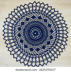 Blue crochet doily. This photo has been taken in Kladno, Czech Republic, April 2025