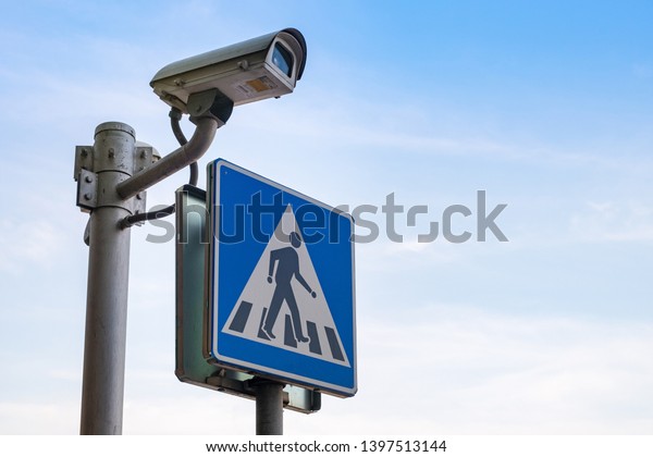 Blue Crosswalk traffic sign and Security Camera\
CCTV Protection at road\
thailand