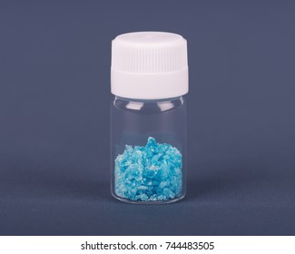 Blue Crystal Of Methamphetamine In A Glass Jar On The Table. Blue Ice, Bath Salt, Drug. Blue Meth.