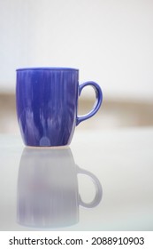  A Blue Cup Of Cofee On The Table