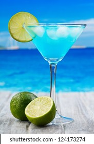 Blue Curacao cocktail on a beach