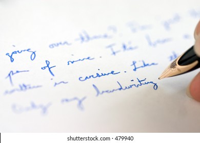 Blue Cursive Handwriting With Pen