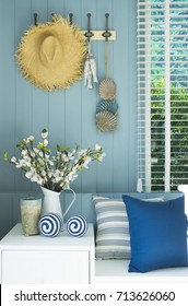 Blue Cushion And Flower Vase In Coastal Home