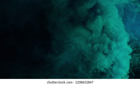 Blue And Cyan Bomb Smoke On Black Background