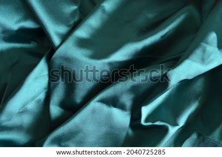 Blue cyan color fabric texture background for inserting your text
