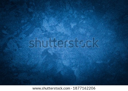 Blue decorative plaster texture with vignette. Abstract grunge background with copy space for design.