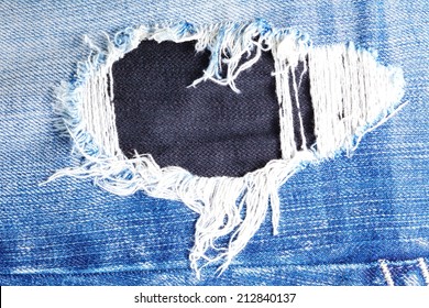 Blue Denim Jeans In Bright Color Tear Up Surface Condition Present The Old Damaging Fabric Damaged Detail Of Texture Background. 